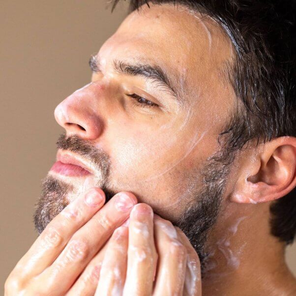 man washing his beard with LUSH beard wash