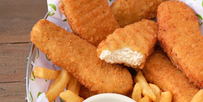 a basket of beyond meat's vegan chicken tenders with french fries