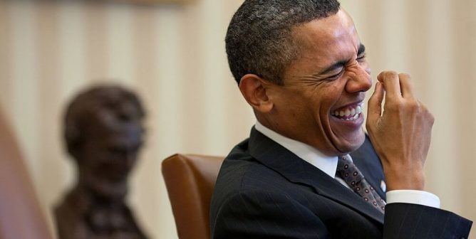 Former President Barack Obama laughing.