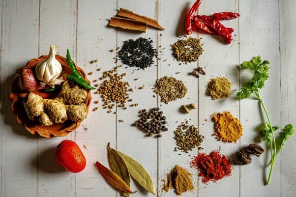 a variety of spices on a white background