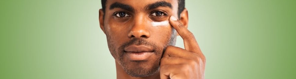 man applying skincare to his face