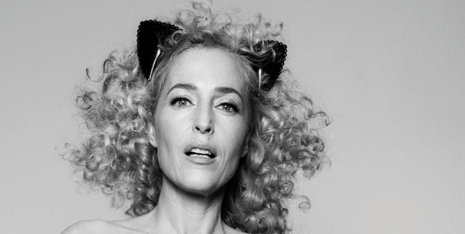 gillian anderson wearing animal ears on a gray background