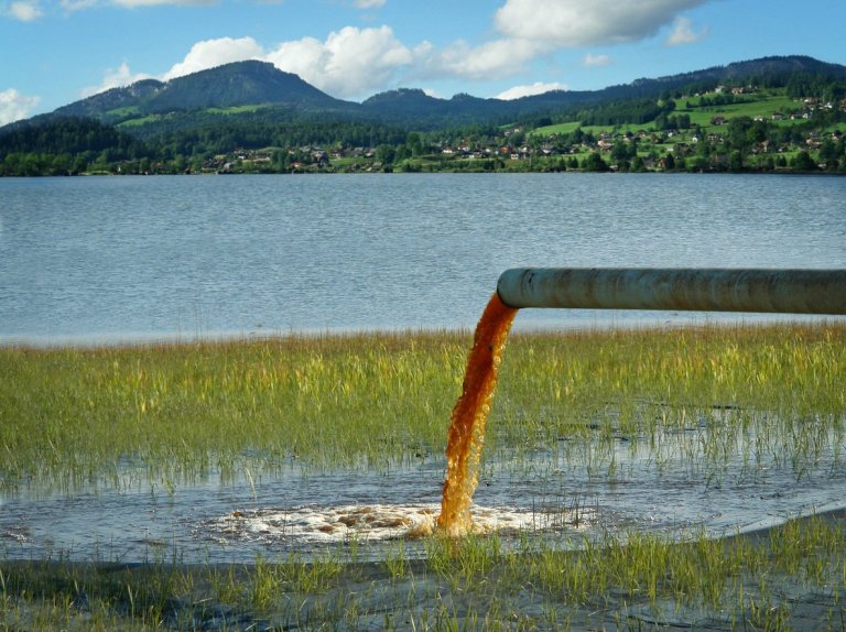 pipe dumping pollution into freshwater