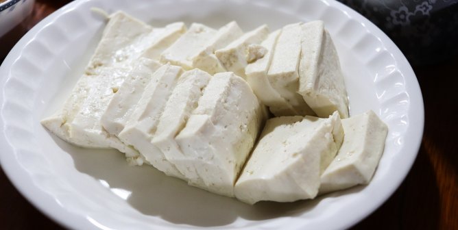 Sliced tofu on a white plate