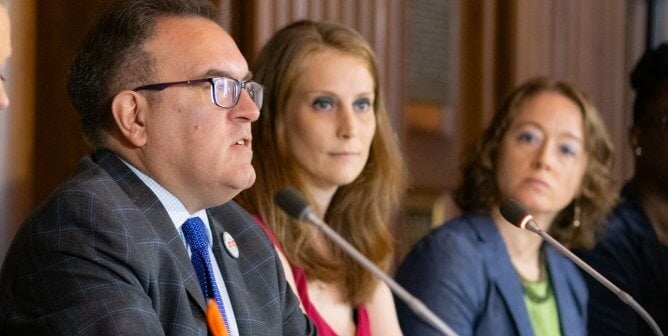 PETA scientist Dr. Amy Clippinger sits next to EPA Administrator Andrew Wheeler