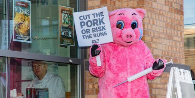 peta pork protest pig syringes des moines 2020
