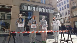 Protestors dressed as animals stand outside of Urban Outfitters in Munich, Germany