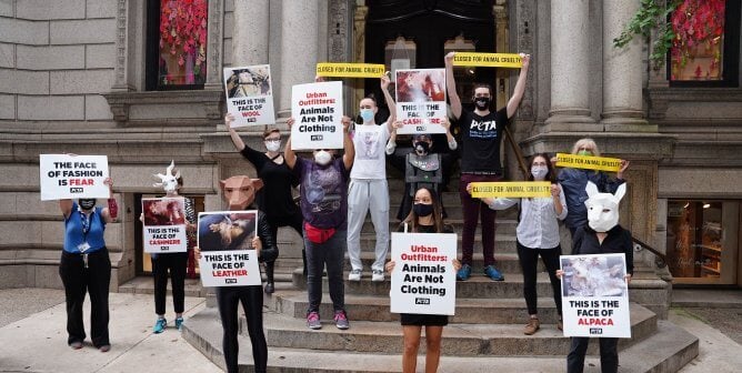Protestors stand on the streets outside Urban Outfitters to protest use of animal products