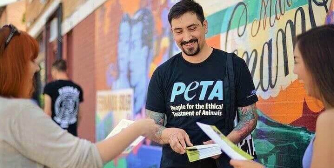 Handing out leaflets for PETA