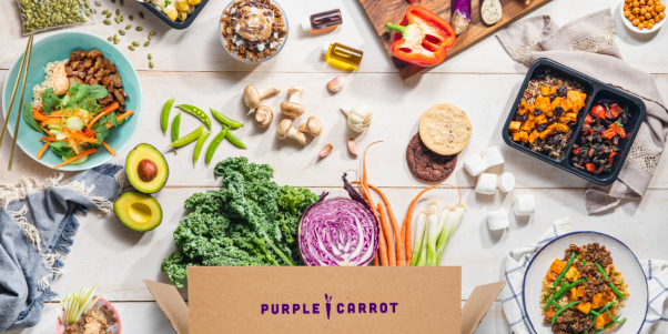 purple carrot promotional image with box and various meals and ingredients