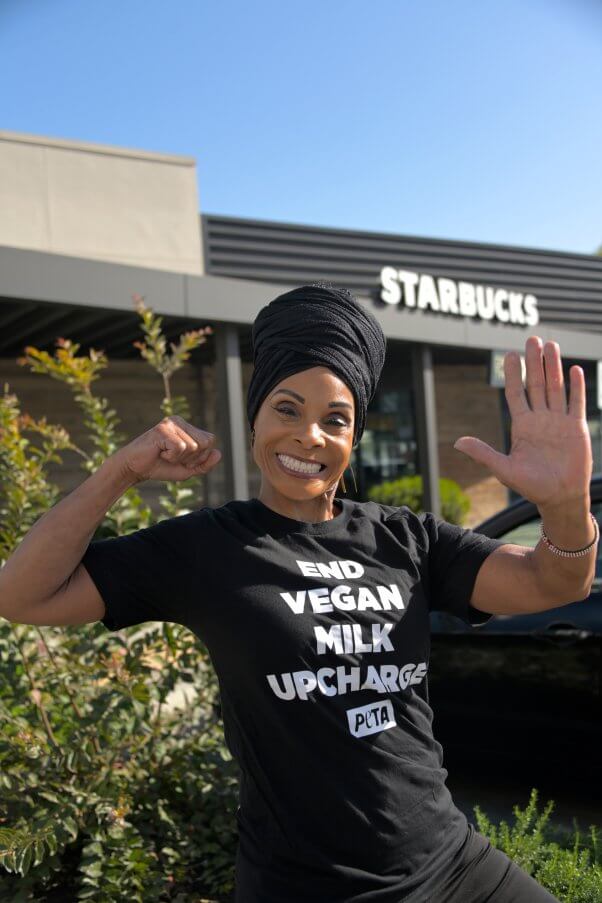 Chef Babette in front of Starbucks to protest vegan milk upcharge