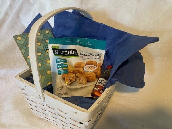 PETA basket with vegan crab cakes and a shot of whiskey, sent to CEO of bankrupt Red Lobster