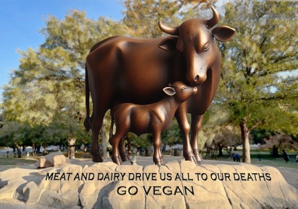photorealistic illustration of bronze statue of mother cow nuzzling her calf, standing on rocks. engraved text on the base reads "meat and dairy drive us all to our deaths. go vegan"