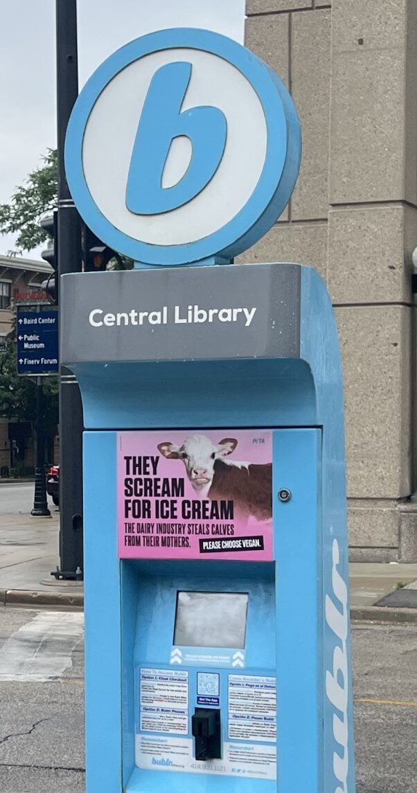 Close up of library bike station kiosk showing the ad