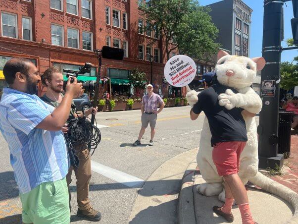 man hugs PETA mouse at 2024 republican national convention