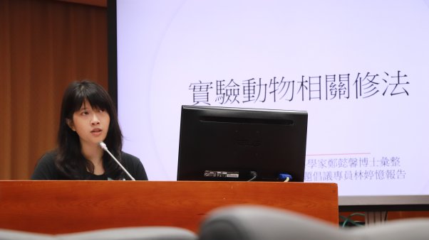 Woman at podium during public testimony