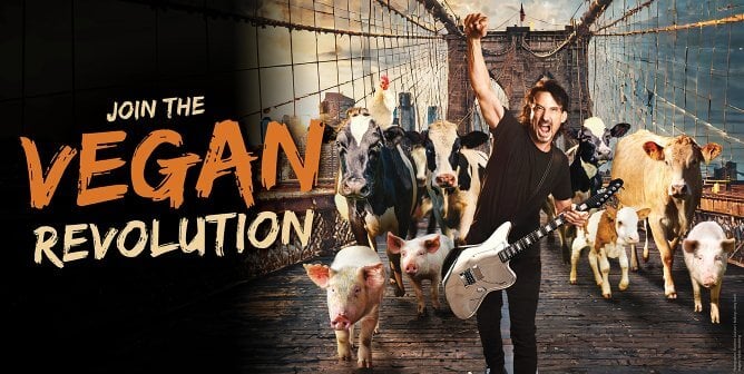 Joe DuPlantier fist in the air leading animals over bridge next to text that says "Join the vegan revolution"