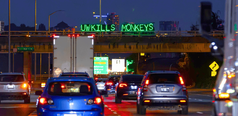 Electrifying Highway Display in Seattle Illuminates Atrocities at Primate Prison