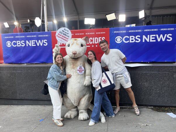 NIH mouse protester posing with people