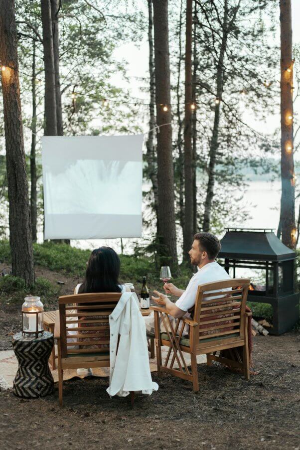 a couple watching an outdoor movie