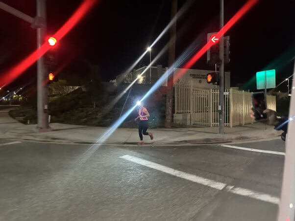 runner wearing headlamp at night