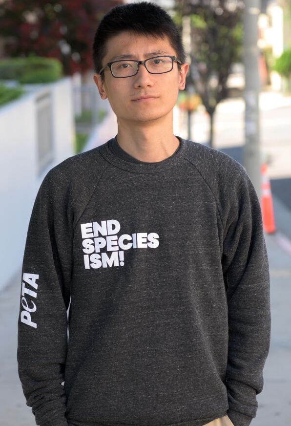 Man wearing an End Speciesism sweatshirt