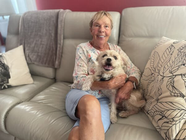 Small white dog in a couch