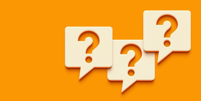 question mark symbols against an orange background