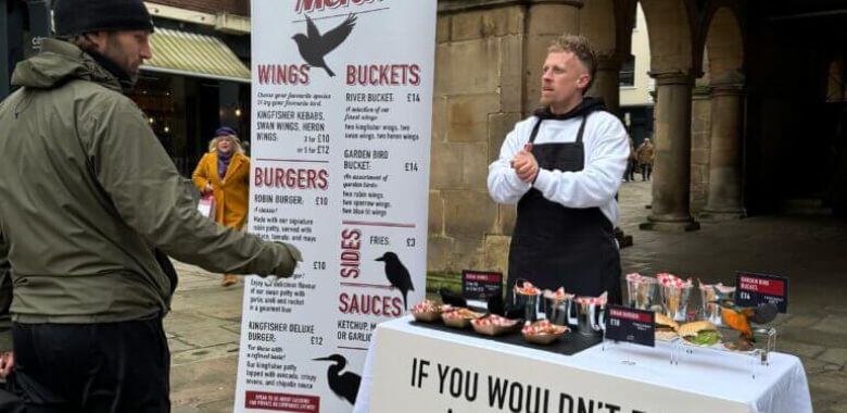 Demonstrator at a mock-up takeaway table