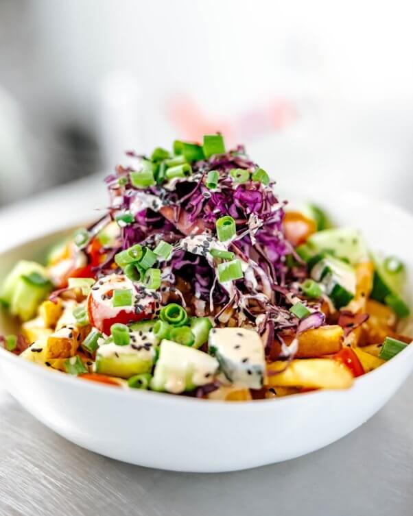 Poutine featuring purple cabbage and chives